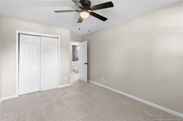 1718 Shiloh Dr, Fayetteville, NC 28304 - unfurnished bedroom with carpet flooring, a closet, and a ceiling fan