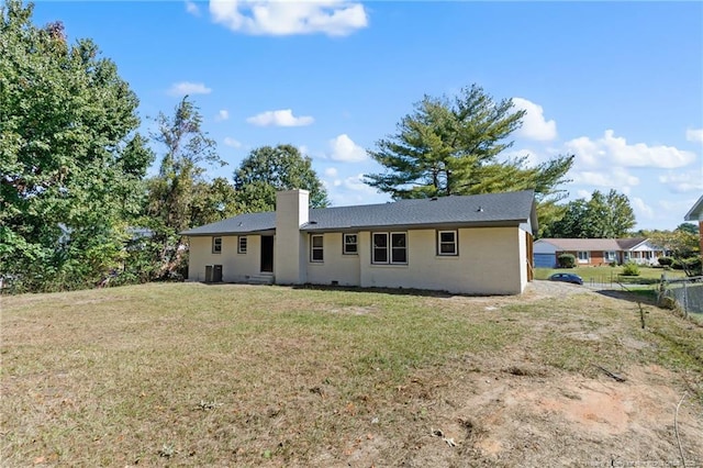 1718 Shiloh Dr, Fayetteville, NC 28304 - back of house with a lawn, a chimney, and stucco siding