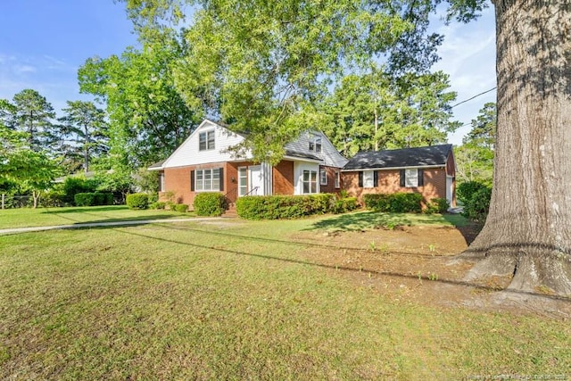 1905 N Rowland Ave N, Lumberton, NC 28358 - view of front facade with a front yard and brick siding