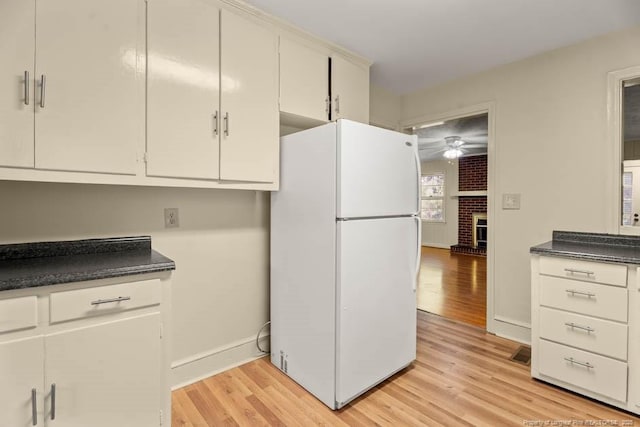 1905 N Rowland Ave N, Lumberton, NC 28358 - kitchen with freestanding refrigerator, light wood-style floors, and dark countertops