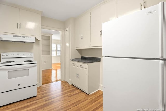 1905 N Rowland Ave N, Lumberton, NC 28358 - kitchen featuring white appliances, under cabinet range hood, light wood finished floors, and dark countertops