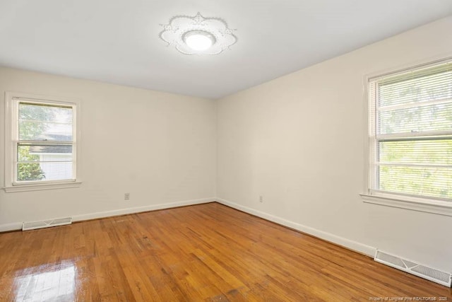 1905 N Rowland Ave N, Lumberton, NC 28358 - empty room with plenty of natural light and light wood-type flooring