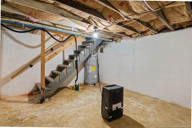 1905 N Rowland Ave N, Lumberton, NC 28358 - unfinished below grade area featuring electric water heater and stairway