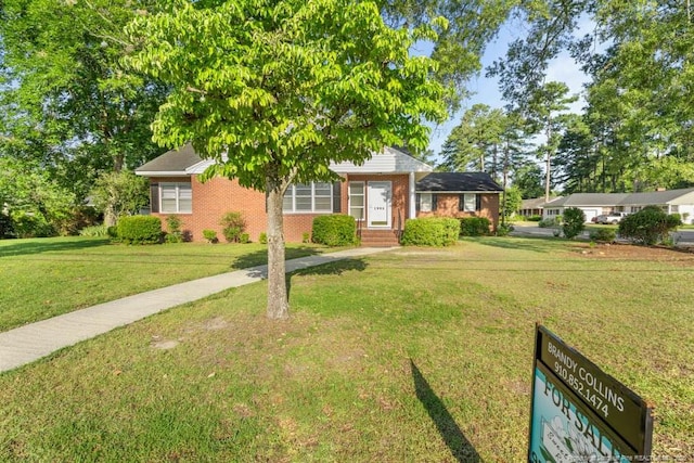 1905 N Rowland Ave N, Lumberton, NC 28358 - view of front of house featuring brick siding and a front yard