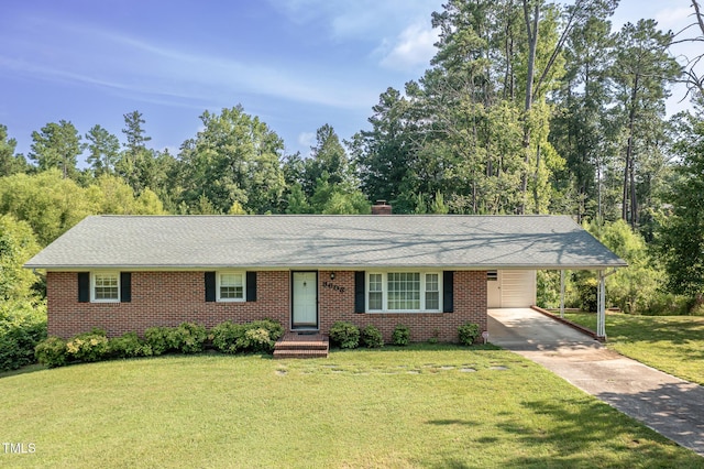 3603 Grimes Ave, Durham, NC 27703 - single story home with driveway, brick siding, a front yard, an attached carport, and a chimney
