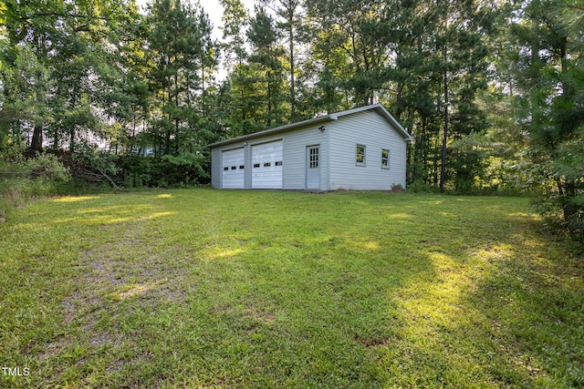 3603 Grimes Ave, Durham, NC 27703 - view of grassy yard featuring an outbuilding and a garage