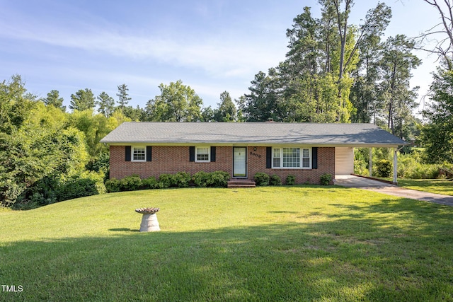 3603 Grimes Ave, Durham, NC 27703 - ranch-style house with driveway, an attached carport, brick siding, and a front lawn