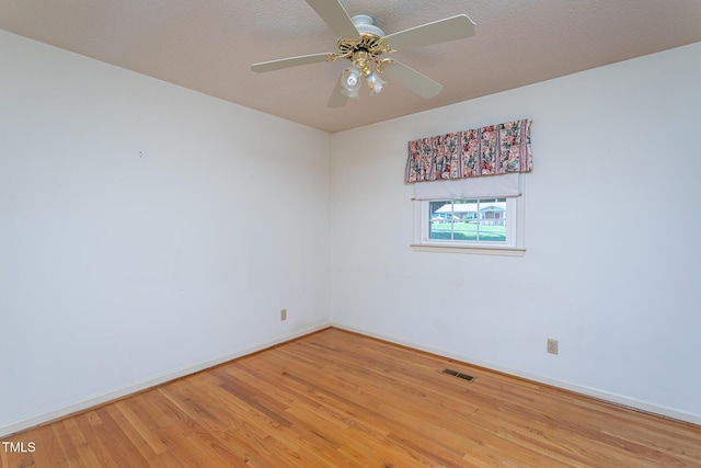 3603 Grimes Ave, Durham, NC 27703 - unfurnished room with light wood finished floors and ceiling fan