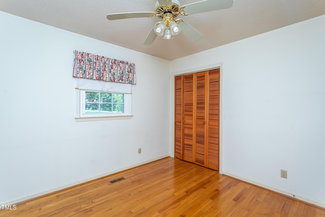 3603 Grimes Ave, Durham, NC 27703 - unfurnished bedroom featuring light wood-style floors, a closet, and ceiling fan