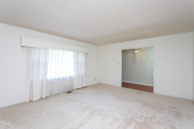 3603 Grimes Ave, Durham, NC 27703 - carpeted empty room with baseboards