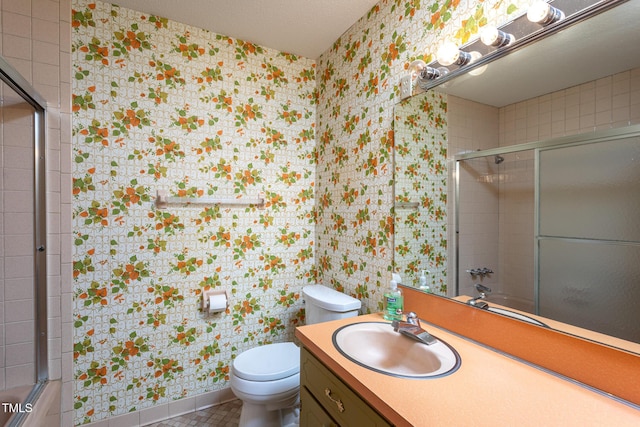 3603 Grimes Ave, Durham, NC 27703 - full bath with wallpapered walls, a shower with shower door, vanity, and tile patterned floors