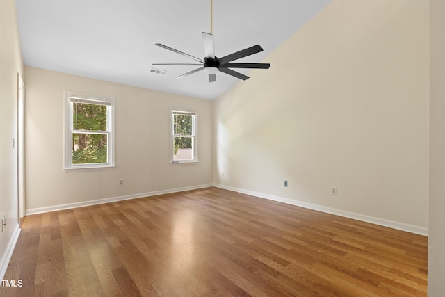 3421 Tunas St, Raleigh, NC 27616 - empty room featuring wood finished floors, ceiling fan, and lofted ceiling