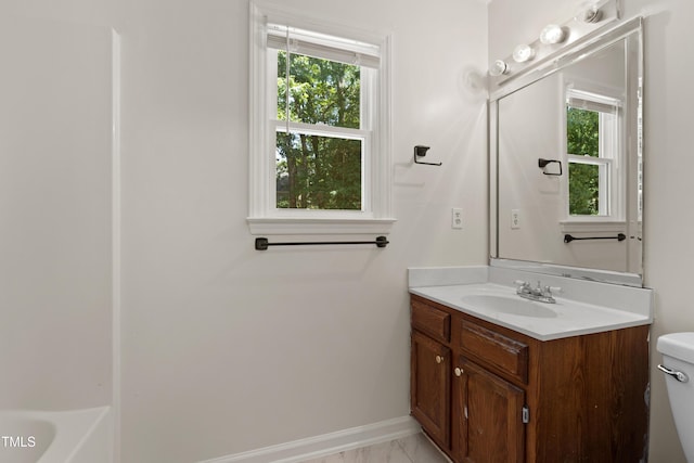 3421 Tunas St, Raleigh, NC 27616 - full bath featuring vanity, plenty of natural light, and marble look tiles