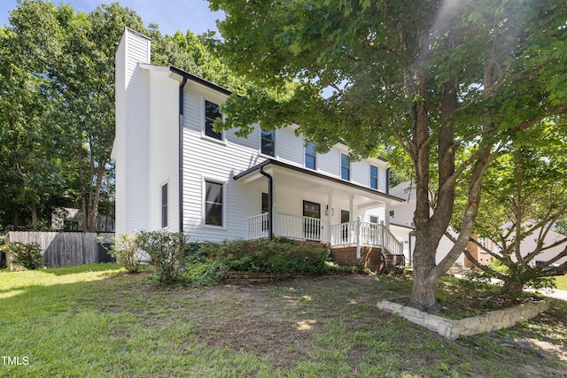 3421 Tunas St, Raleigh, NC 27616 - view of front of house featuring a chimney and covered porch