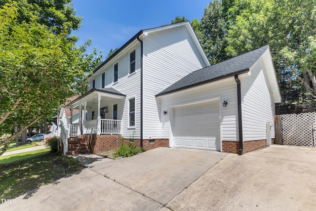3421 Tunas St, Raleigh, NC 27616 - view of front of house featuring driveway, a garage, covered porch, roof with shingles, and crawl space