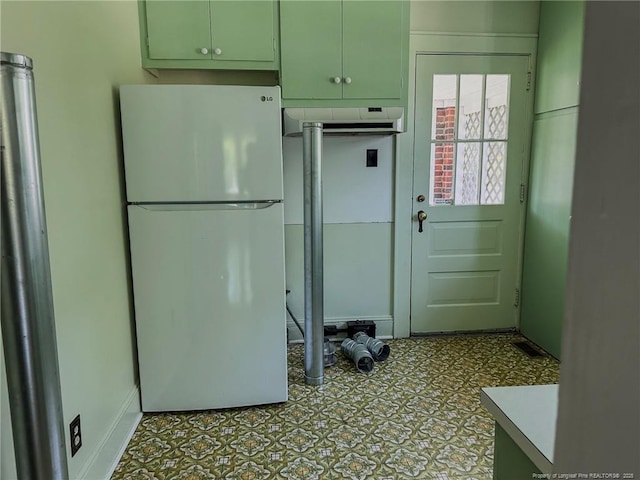202 E 17th St, Lumberton, NC 28358 - kitchen featuring freestanding refrigerator and baseboards