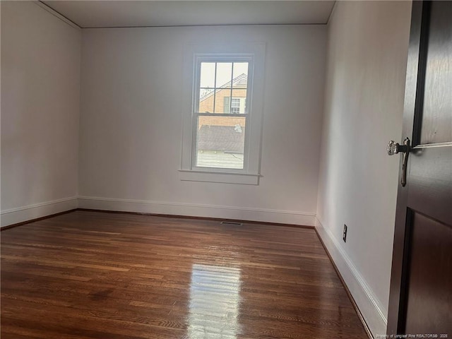 202 E 17th St, Lumberton, NC 28358 - unfurnished room with dark wood finished floors and baseboards