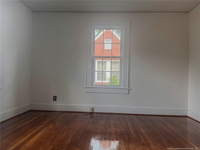 202 E 17th St, Lumberton, NC 28358 - spare room featuring dark wood-style floors
