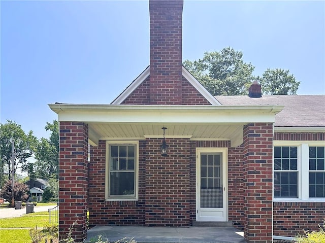 202 E 17th St, Lumberton, NC 28358 - view of side of property featuring brick siding and a chimney