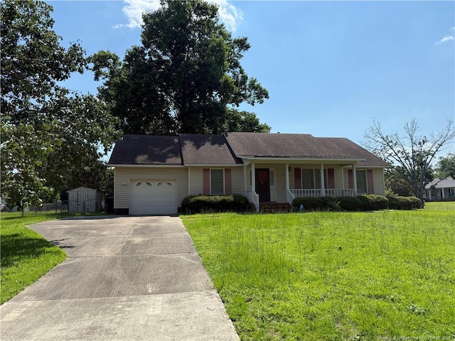 1886 Windlock Dr, Fayetteville, NC 28304 - ranch-style house featuring covered porch, a garage, a front yard, and concrete driveway
