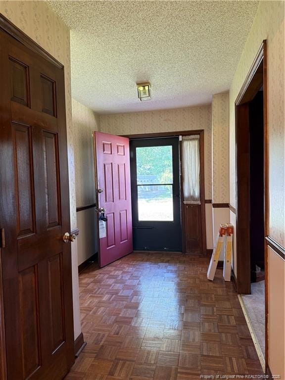 1886 Windlock Dr, Fayetteville, NC 28304 - foyer entrance with wallpapered walls and a textured ceiling