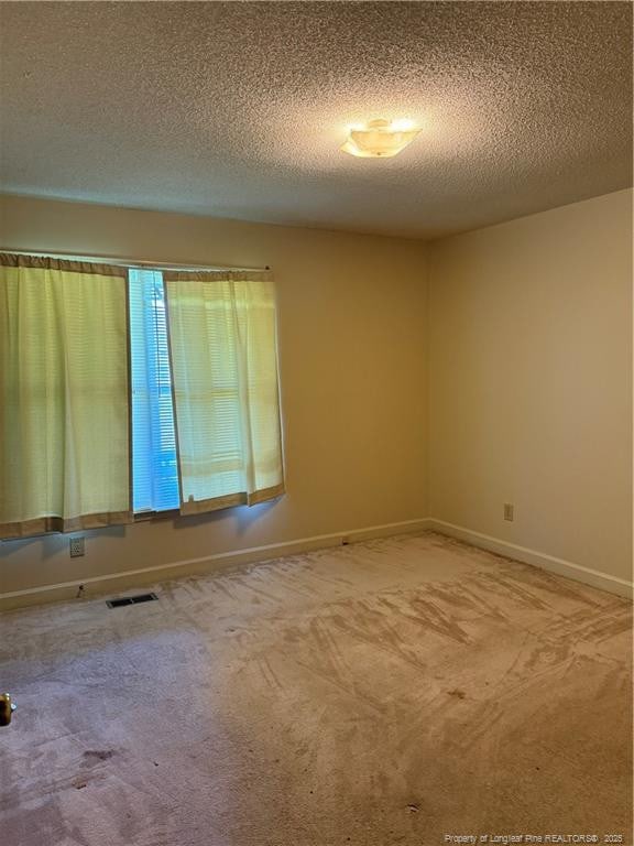 1886 Windlock Dr, Fayetteville, NC 28304 - spare room with carpet floors and a textured ceiling