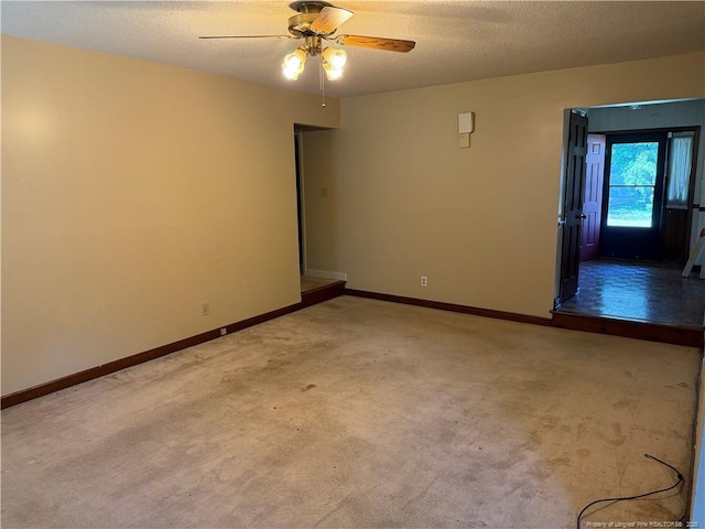 1886 Windlock Dr, Fayetteville, NC 28304 - spare room featuring carpet floors, a ceiling fan, and a textured ceiling