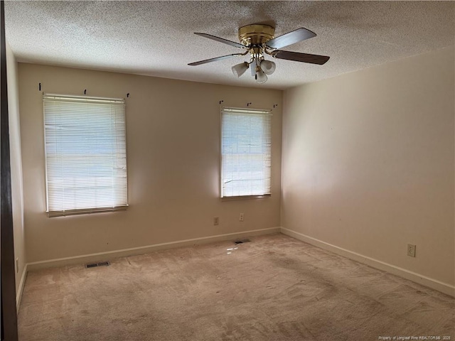 1886 Windlock Dr, Fayetteville, NC 28304 - carpeted spare room featuring ceiling fan and a textured ceiling