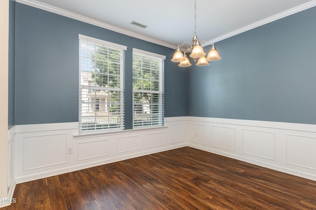 713 Summer Music Ln, Raleigh, NC 27603 - empty room featuring a chandelier, crown molding, dark wood-style floors, wainscoting, and a decorative wall