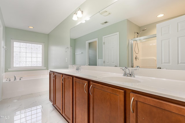 713 Summer Music Ln, Raleigh, NC 27603 - full bathroom featuring a garden tub, double vanity, a shower with door, marble look tiles, and recessed lighting