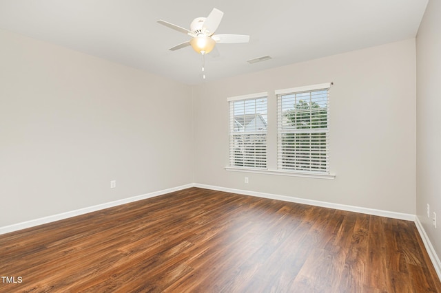 713 Summer Music Ln, Raleigh, NC 27603 - empty room with dark wood-style flooring and a ceiling fan