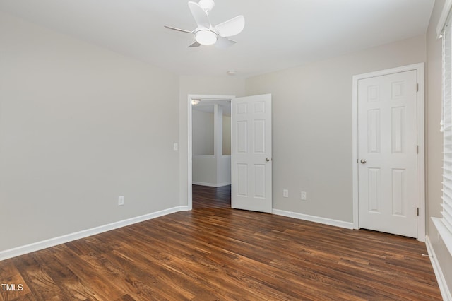 713 Summer Music Ln, Raleigh, NC 27603 - unfurnished bedroom with dark wood finished floors and a ceiling fan
