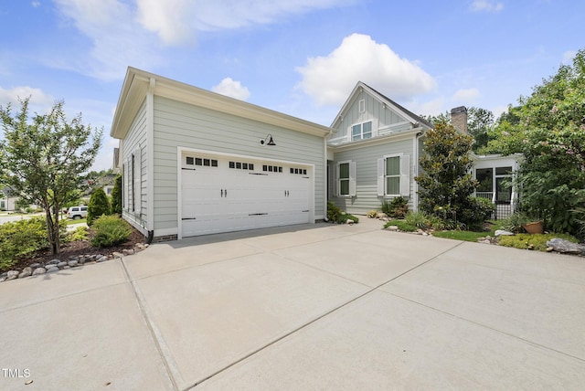 733 Daniel Ridge Rd, Wendell, NC 27591 - view of front of property with concrete driveway, board and batten siding, and a garage