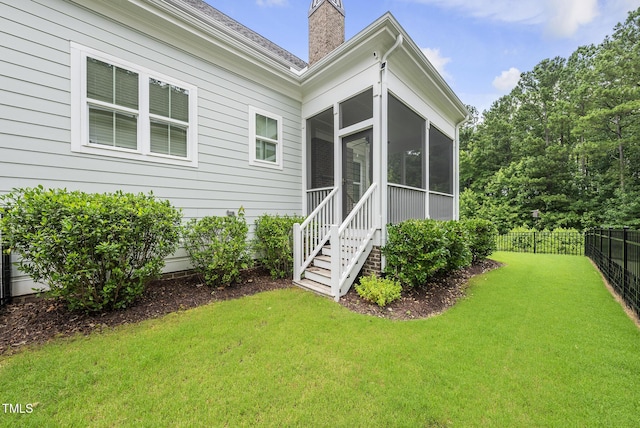 733 Daniel Ridge Rd, Wendell, NC 27591 - rear view of property with a sunroom and a chimney