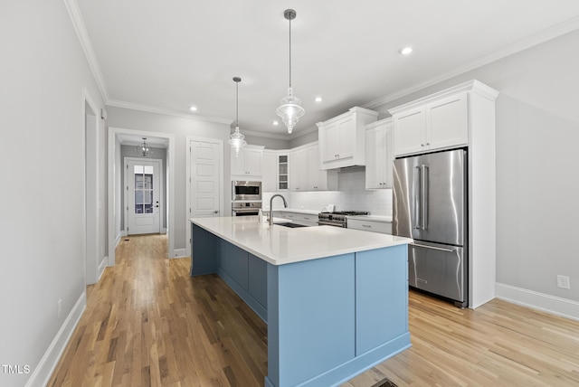 733 Daniel Ridge Rd, Wendell, NC 27591 - kitchen with high end appliances, recessed lighting, white cabinets, tasteful backsplash, and light wood-style floors