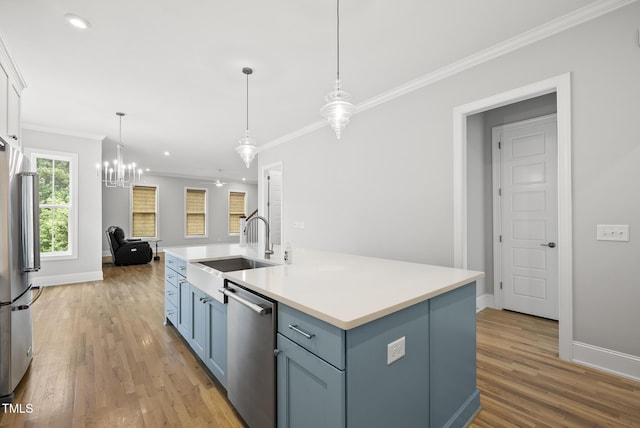 733 Daniel Ridge Rd, Wendell, NC 27591 - kitchen with appliances with stainless steel finishes, crown molding, light wood-style flooring, open floor plan, and light countertops