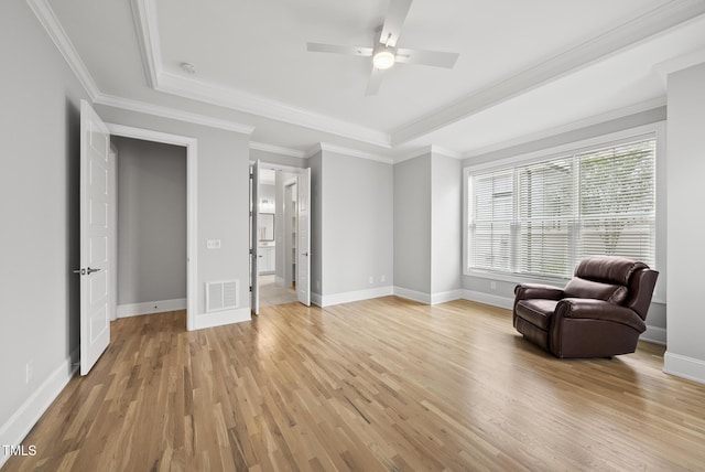 733 Daniel Ridge Rd, Wendell, NC 27591 - sitting room with light wood-style floors, ceiling fan, a raised ceiling, and ornamental molding