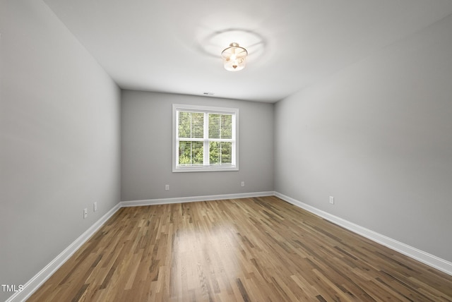 733 Daniel Ridge Rd, Wendell, NC 27591 - spare room with wood finished floors and baseboards
