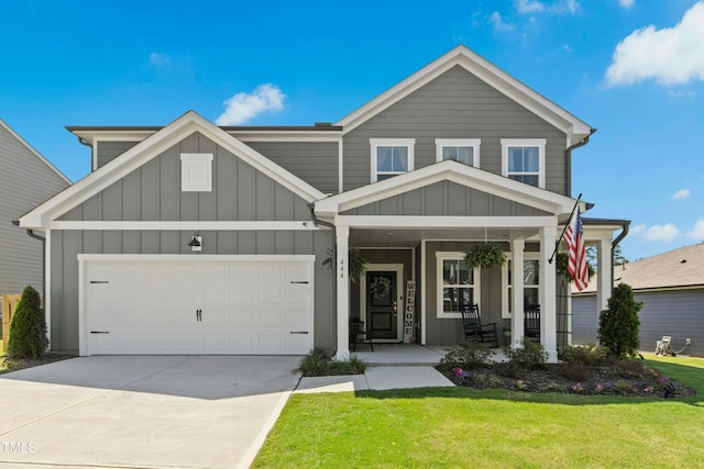 444 Campbell Ridge Pl, Wendell, NC 27591 - view of front facade featuring board and batten siding, a front yard, driveway, and a porch