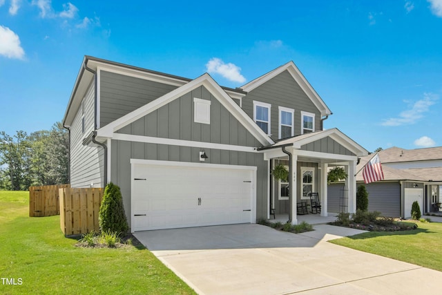 444 Campbell Ridge Pl, Wendell, NC 27591 - view of front facade with board and batten siding, a porch, and concrete driveway