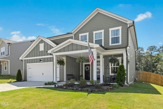 444 Campbell Ridge Pl, Wendell, NC 27591 - view of front of house with board and batten siding, driveway, a garage, and covered porch