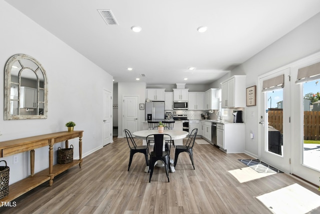 444 Campbell Ridge Pl, Wendell, NC 27591 - dining room with light wood finished floors and recessed lighting
