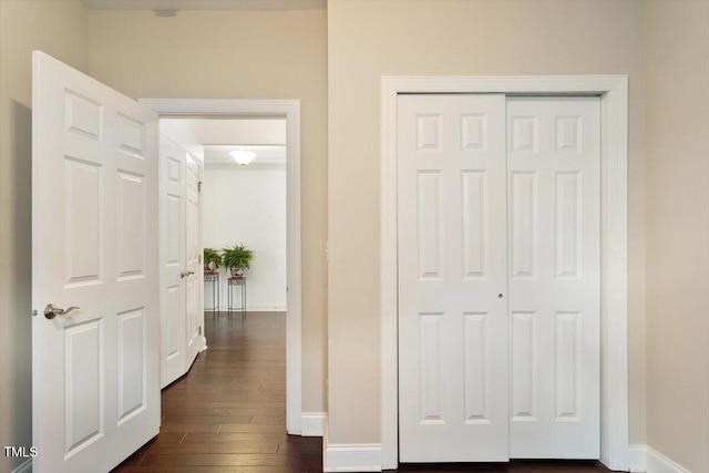 10511 Rosegate Ct Unit 103, Raleigh, NC 27617 - unfurnished bedroom with dark wood-style floors and a closet