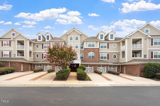 10511 Rosegate Ct Unit 103, Raleigh, NC 27617 - multi unit property with driveway, a garage, and brick siding