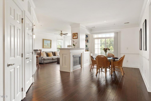 10511 Rosegate Ct Unit 103, Raleigh, NC 27617 - dining space with dark wood-type flooring, ornamental molding, and a ceiling fan