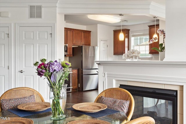 10511 Rosegate Ct Unit 103, Raleigh, NC 27617 - dining space with dark wood finished floors and a tiled fireplace
