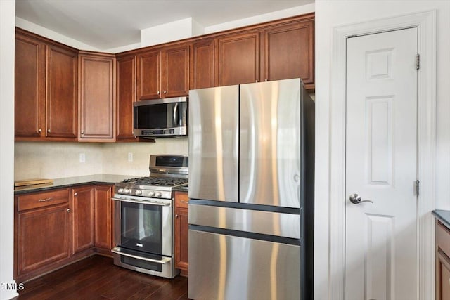 10511 Rosegate Ct Unit 103, Raleigh, NC 27617 - kitchen featuring appliances with stainless steel finishes and dark wood finished floors