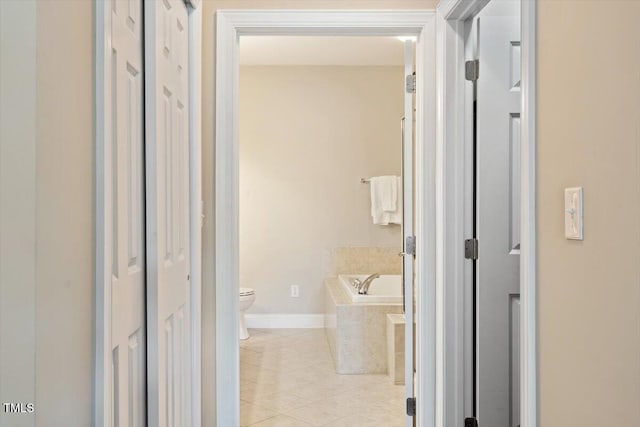10511 Rosegate Ct Unit 103, Raleigh, NC 27617 - corridor featuring light tile patterned floors and baseboards