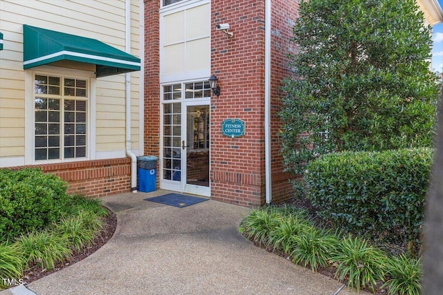 10511 Rosegate Ct Unit 103, Raleigh, NC 27617 - view of exterior entry featuring brick siding and french doors