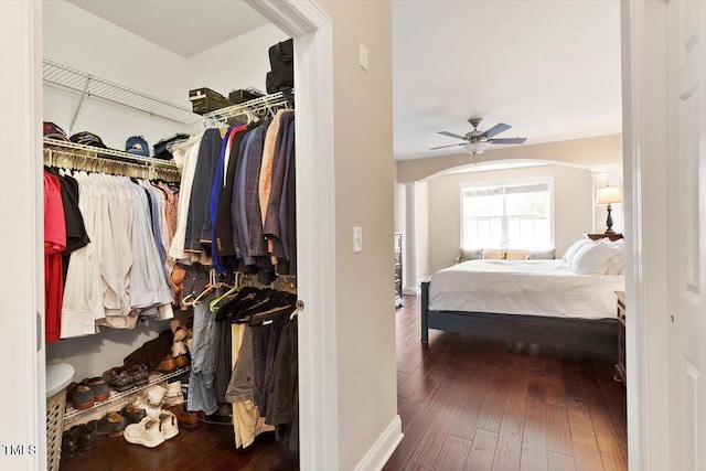 10511 Rosegate Ct Unit 103, Raleigh, NC 27617 - spacious closet with a ceiling fan, arched walkways, hardwood / wood-style flooring, and ornate columns